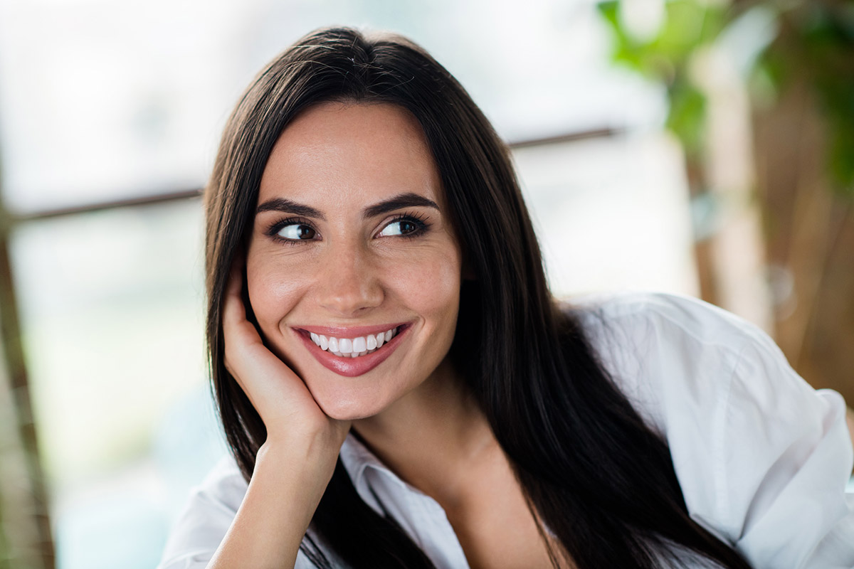 Woman smiling with Porcelain Veneers